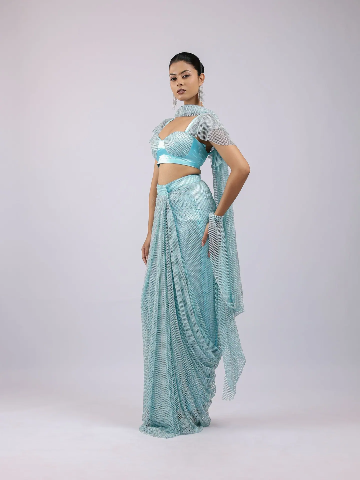 Aqua pre-draped saree with crystal bralette and cape sleeves, full length