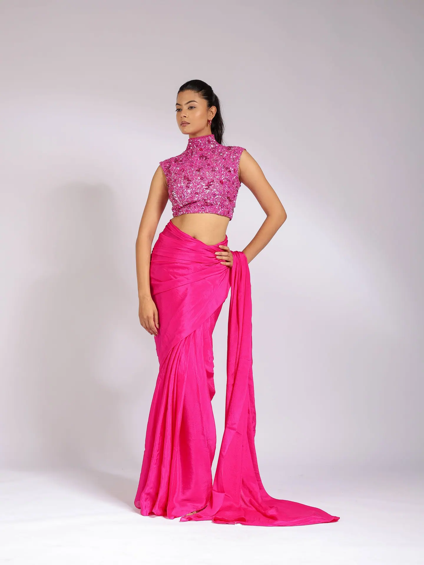 Fuchsia saree with a sequinned high-neck blouse, full length