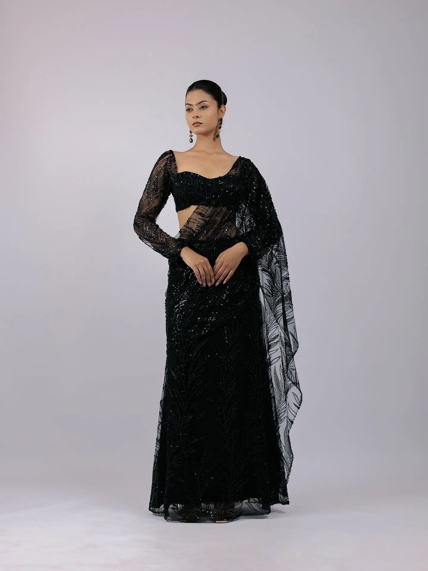 Black sequin saree with sheer full-sleeve blouse, full length