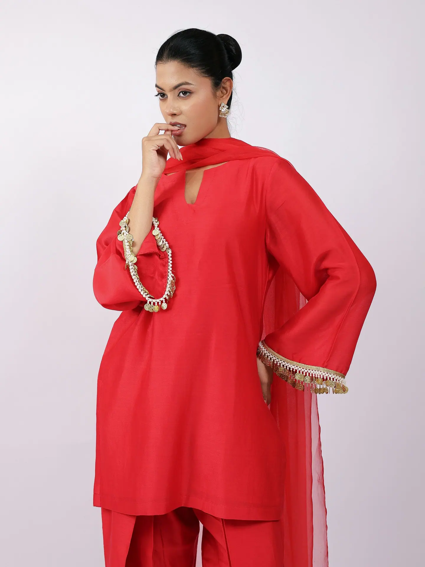 Scarlet kurta with keyhole neck and coin-lace sleeves, waist-up