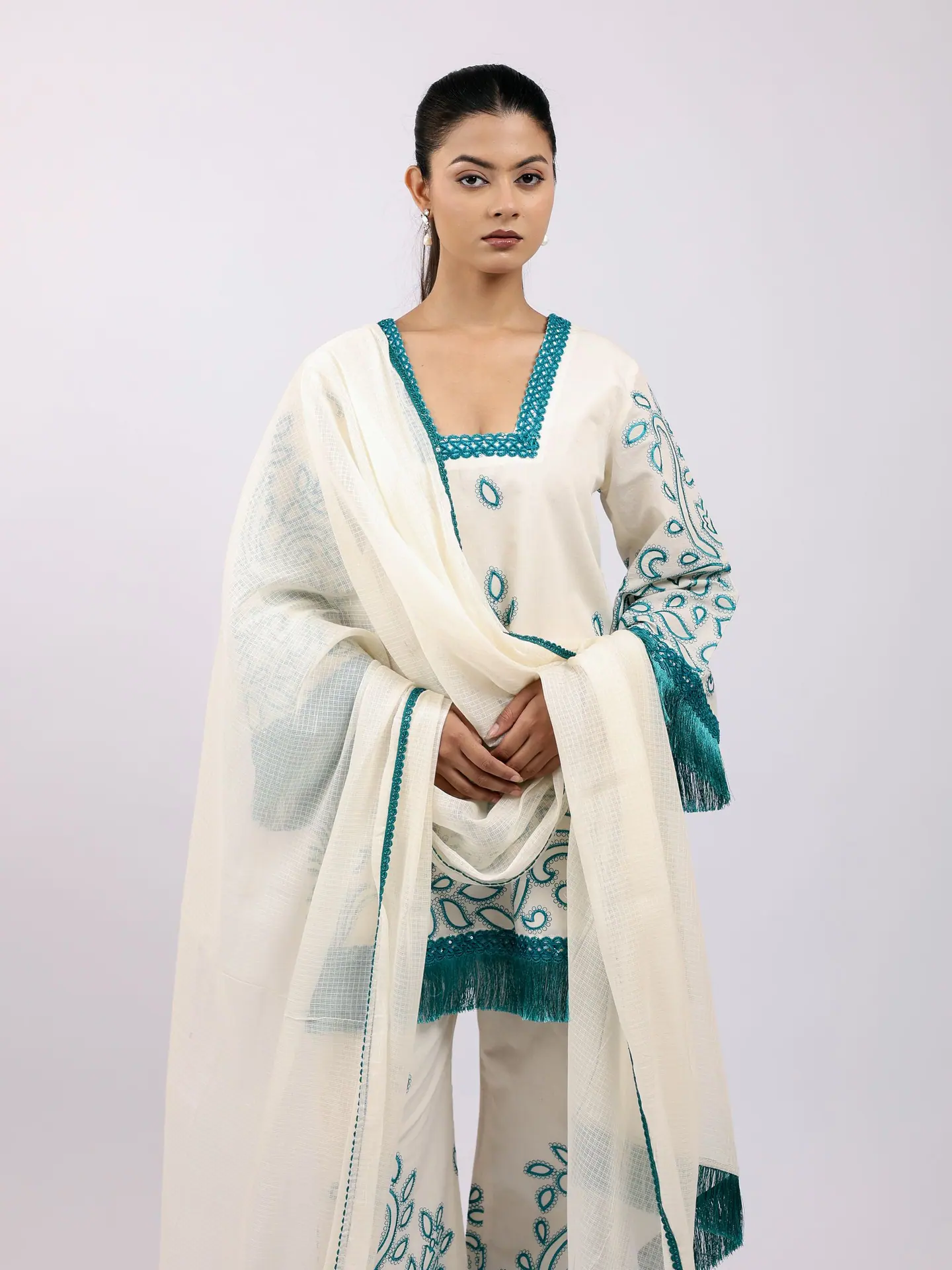 Ivory and teal kurta with the dupatta over both shoulders
