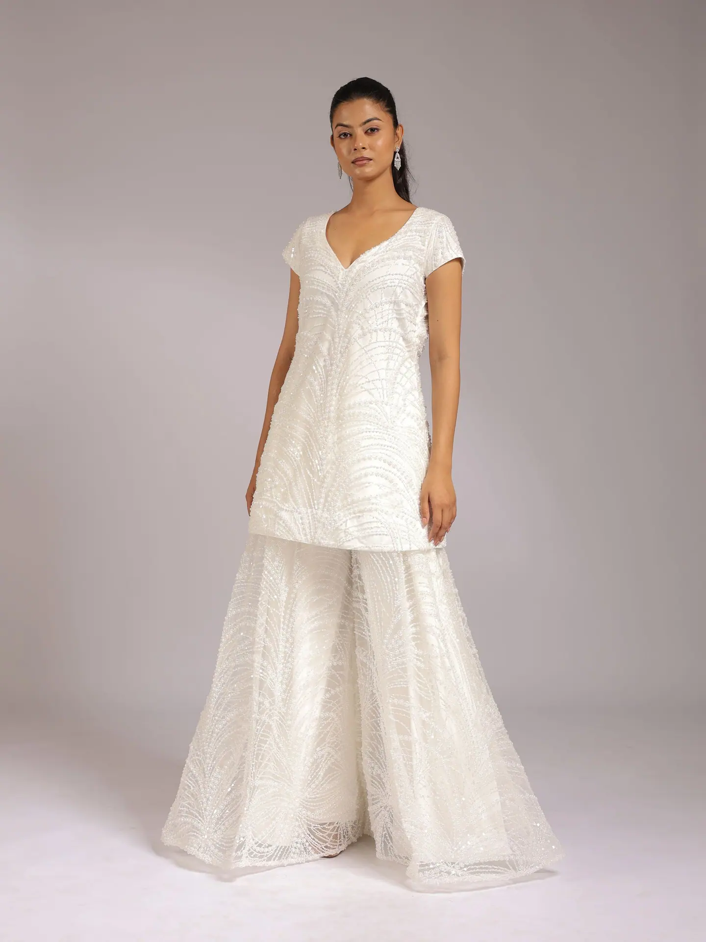 White embroidered V-neck kurta with flared sharara, full length
