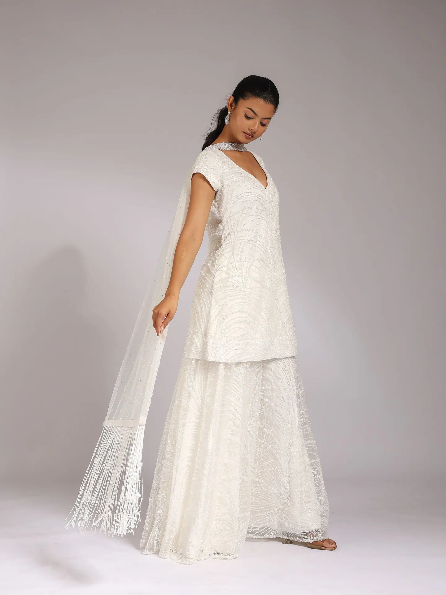 White V-neck sharara set with sheer dupatta, side view